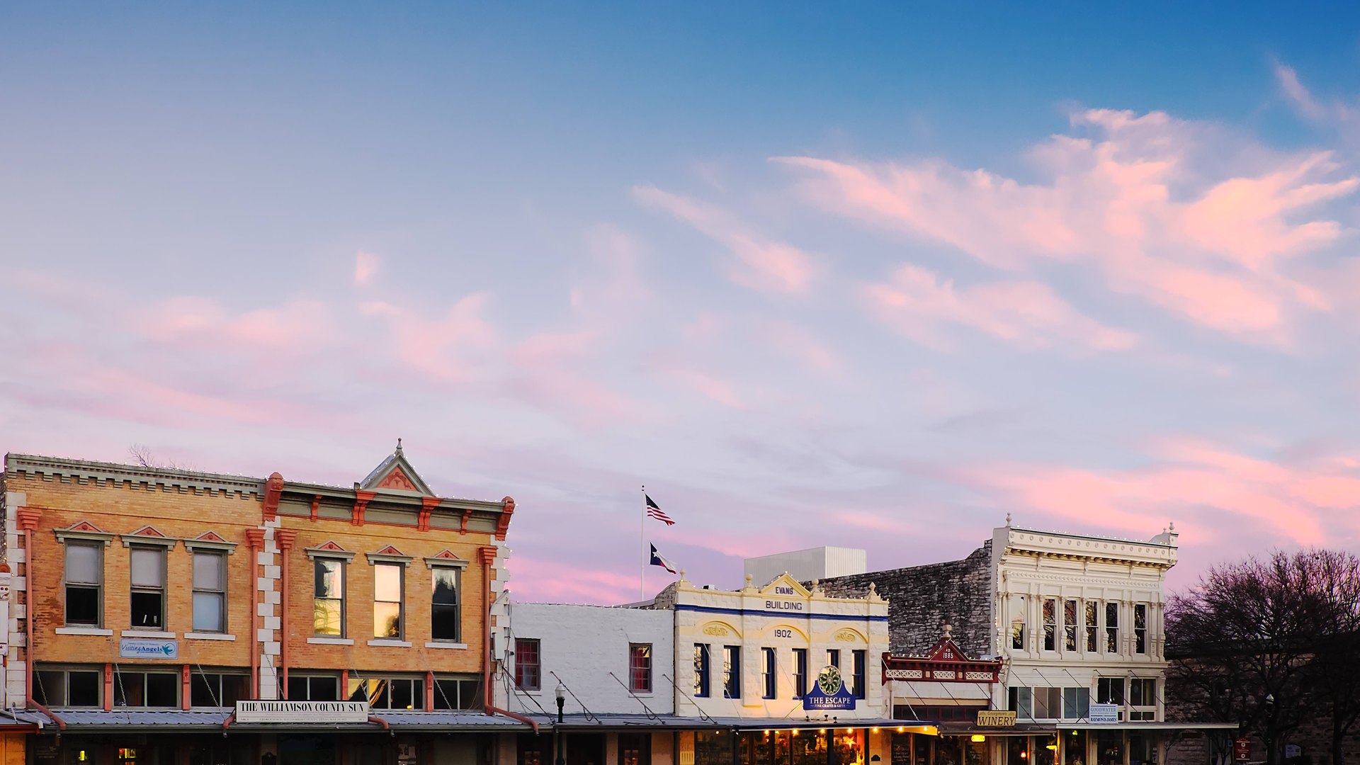 Georgetown Square at dusk — historic Williamson County Sun building, Evans Building 1902, The Escape